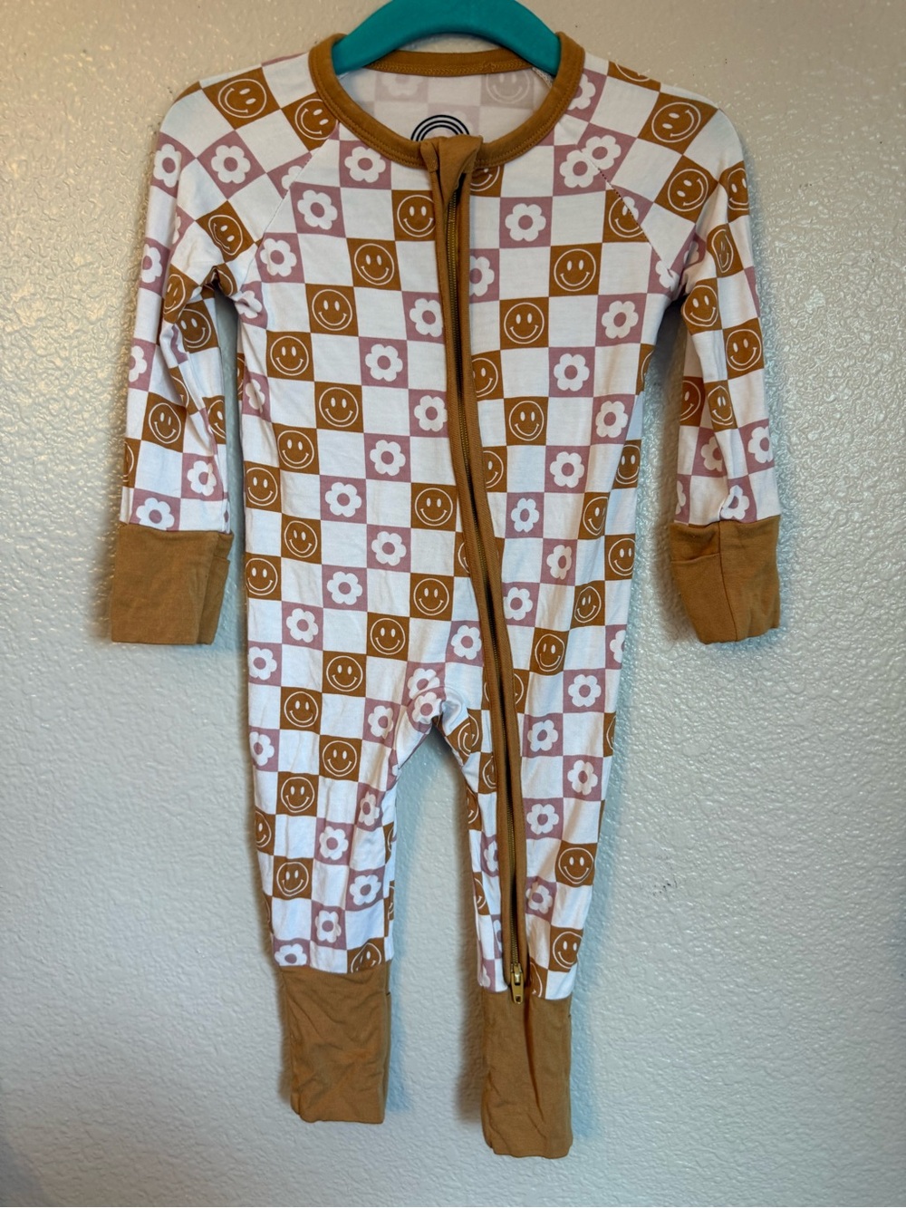 Checker Smile & Flower Footed One-Piece in Brown and Pink
